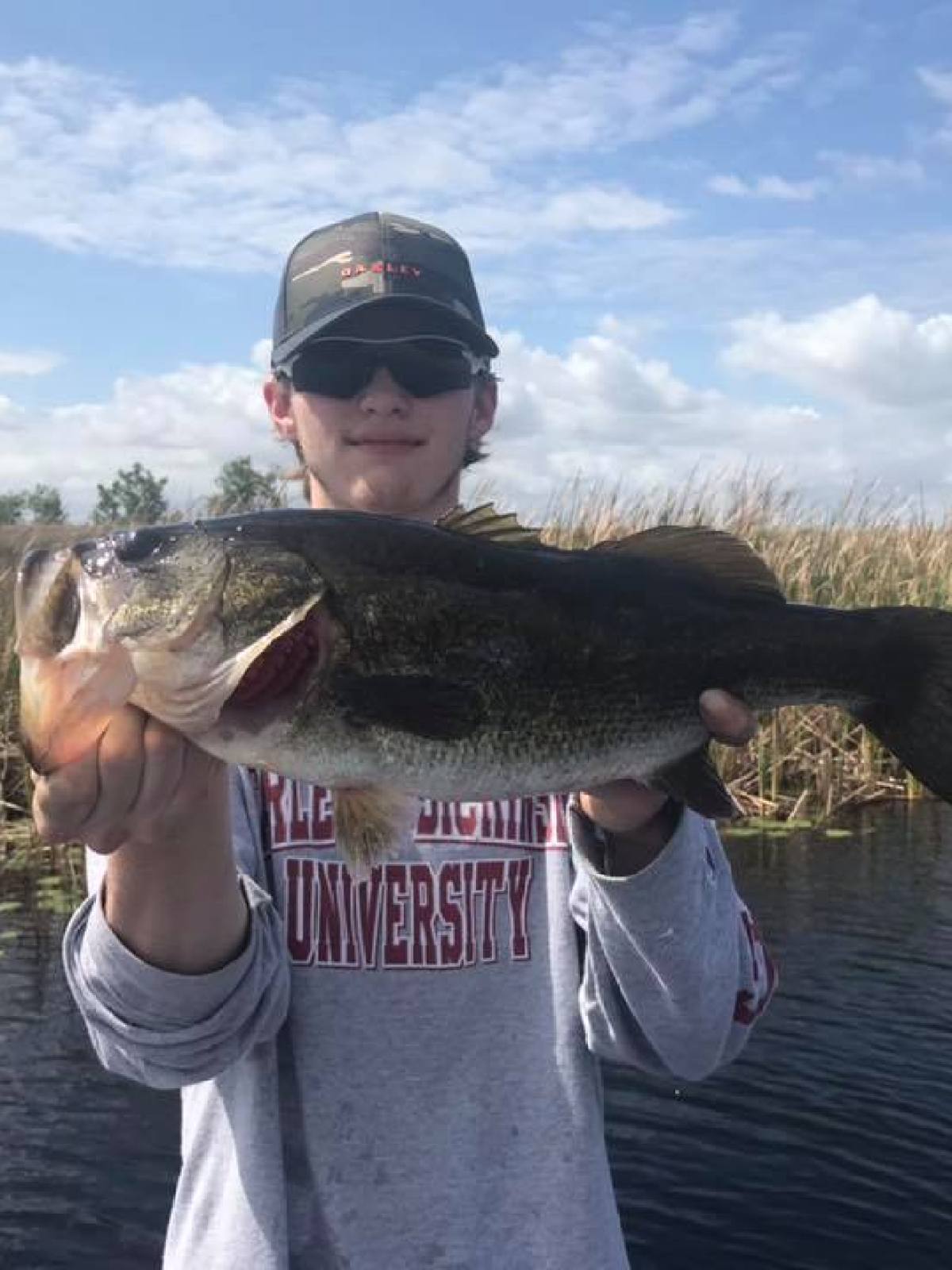 boy holding fish