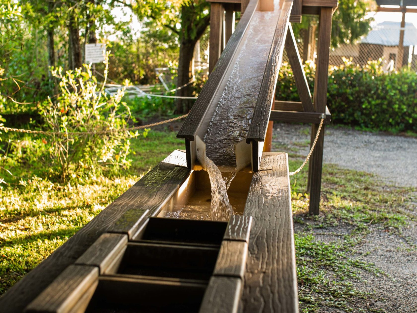 a wooden bench sitting in the grass