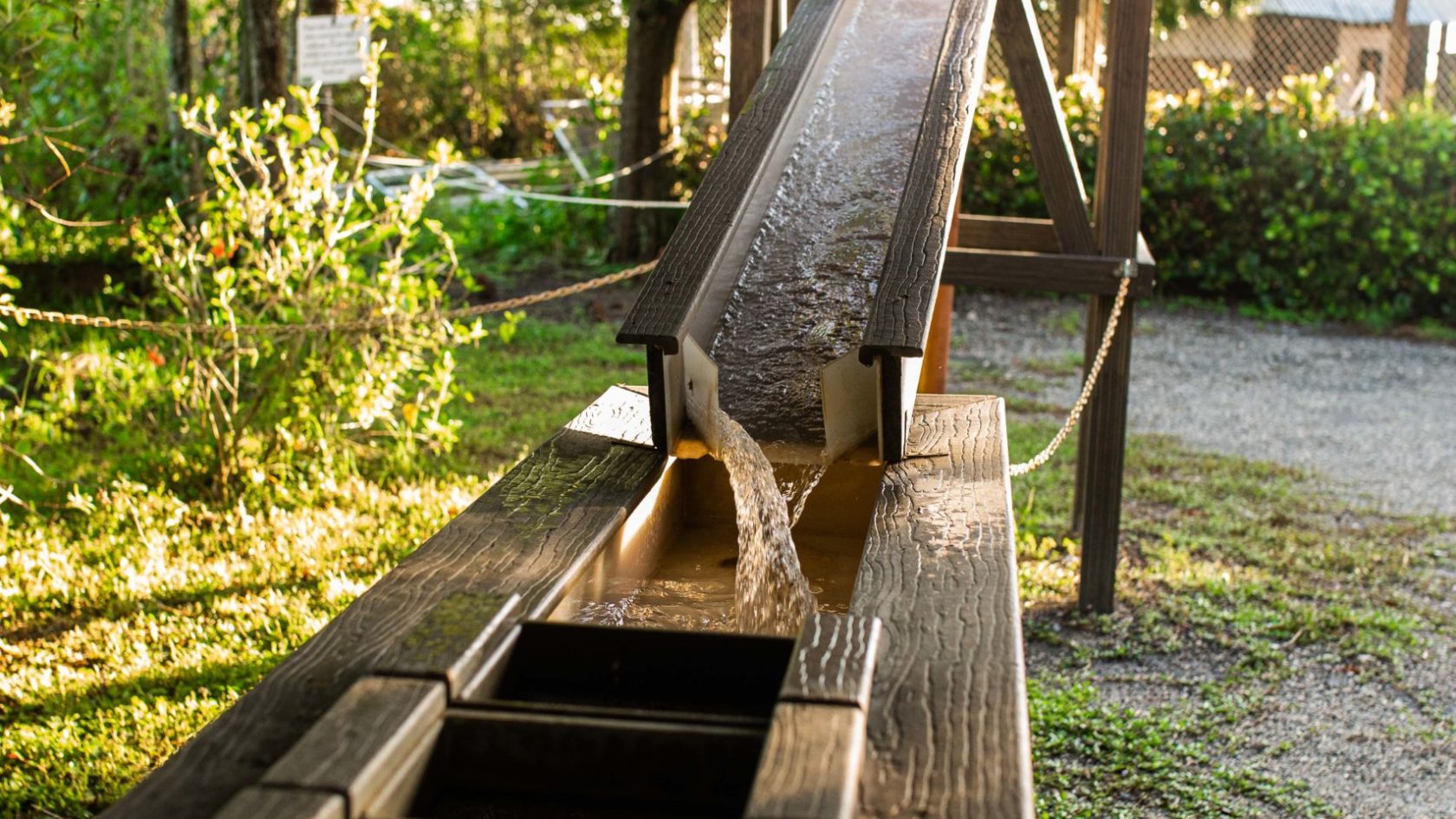 a wooden bench sitting in the grass