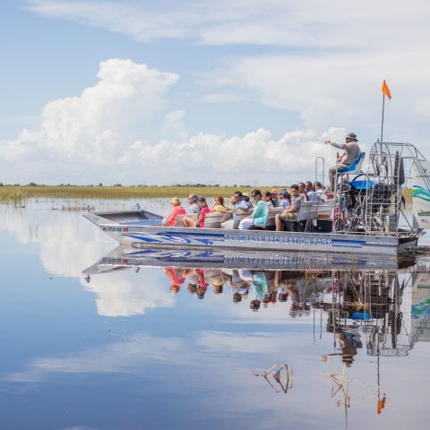 a close up of a boat next to a body of water