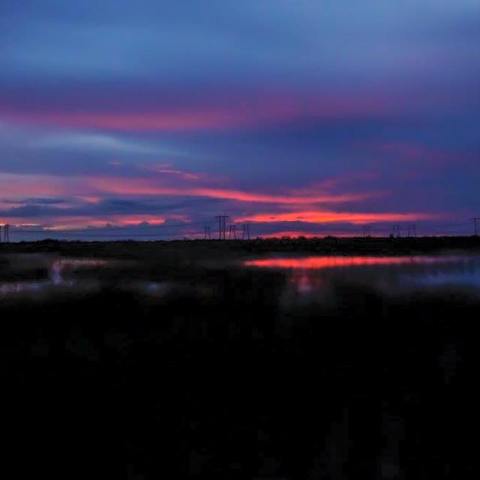 a sunset over a body of water