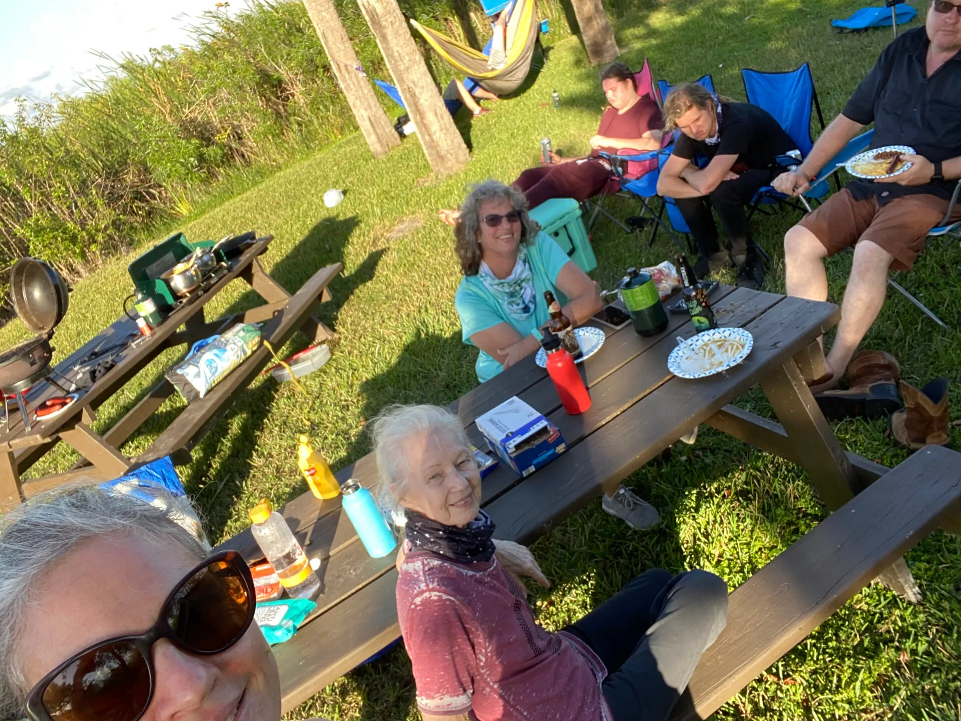 a group of people sitting at a park