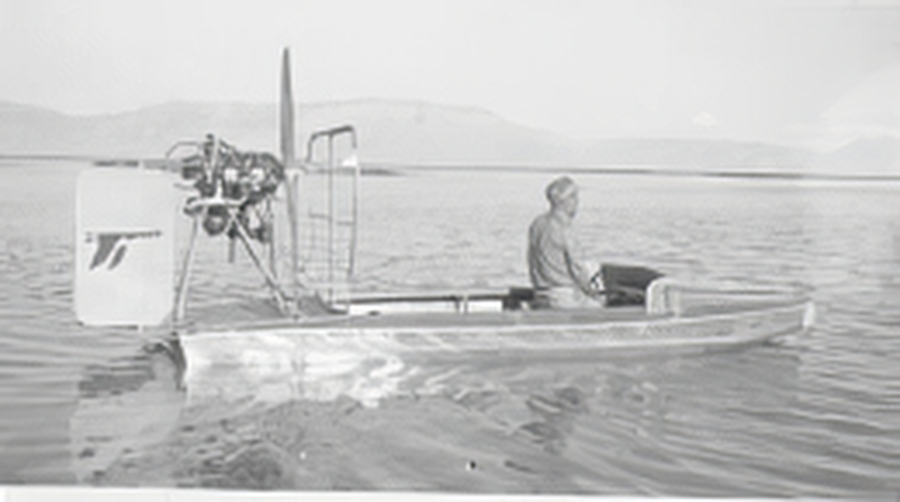 a group of people in a boat on a body of water