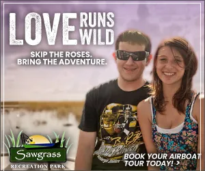 Smiling couple in front of a wetland scenery with 'Love Runs Wild' text and Sawgrass Recreation Park logo.